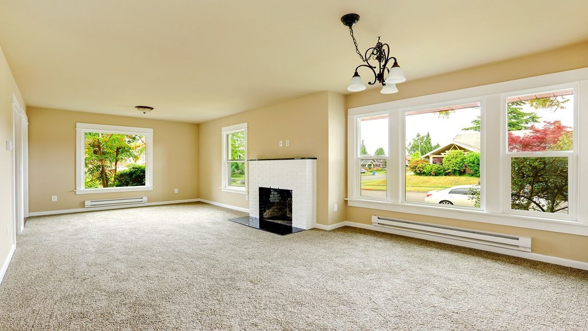 A luxurious modern kitchen featuring hardwood floors and granite countertops.