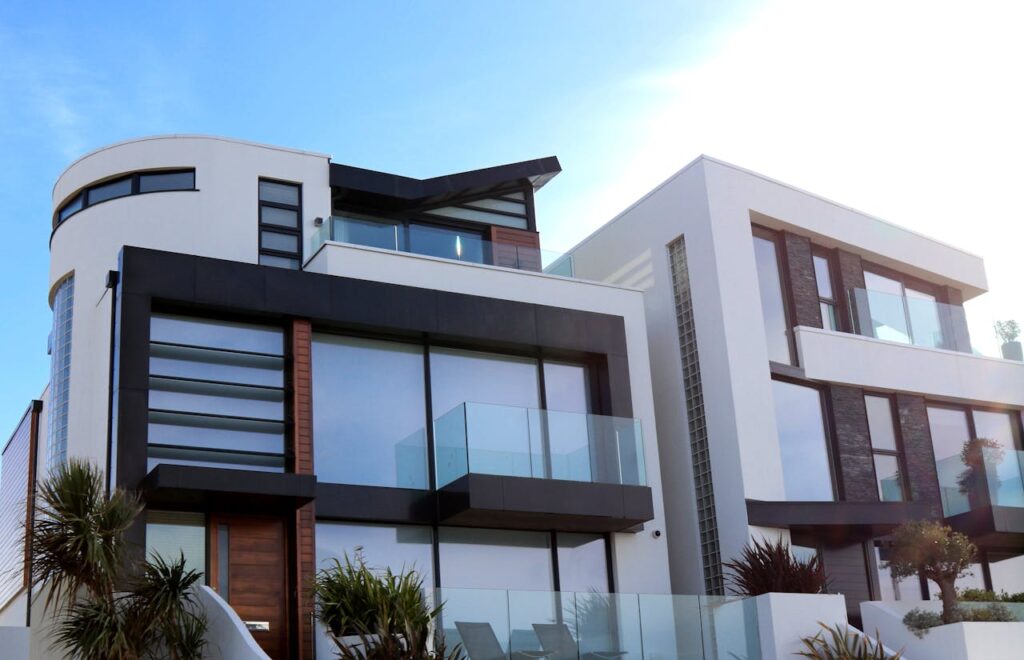 pexels-photo-323780 Contemporary luxury home with glass balconies in Poole, UK, showcasing modern architectural design.